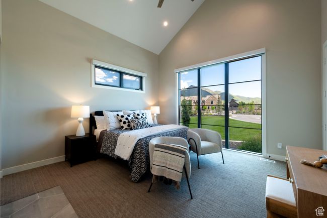 Carpeted bedroom featuring high vaulted ceiling, recessed lighting, and access to outside | Image 36