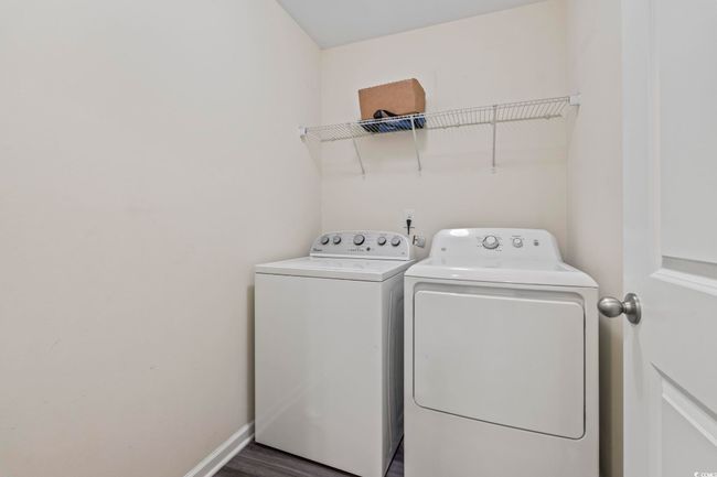 Washroom featuring washer and dryer and baseboards | Image 21