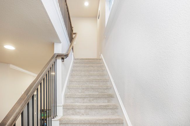 Staircase with recessed lighting and baseboards | Image 23
