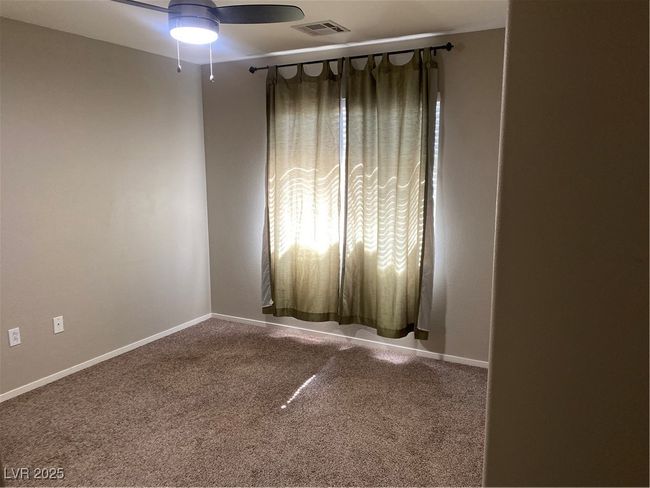 Spare room with visible vents, baseboards, ceiling fan, and carpet floors | Image 18