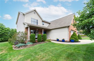 View of front of property with a garage and a front yard | Image 3