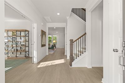 Bright, open entry! Brand new floorplan! These are artist's renderings of staged rooms, not actual home listed | Image 3