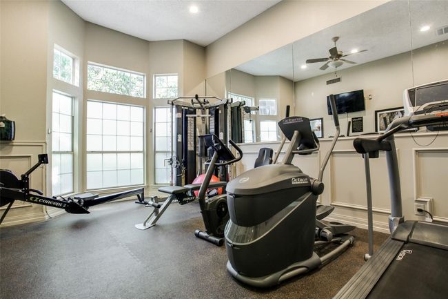 Workout area with plenty of natural light, a ceiling fan, recessed lighting, and a textured ceiling | Image 28