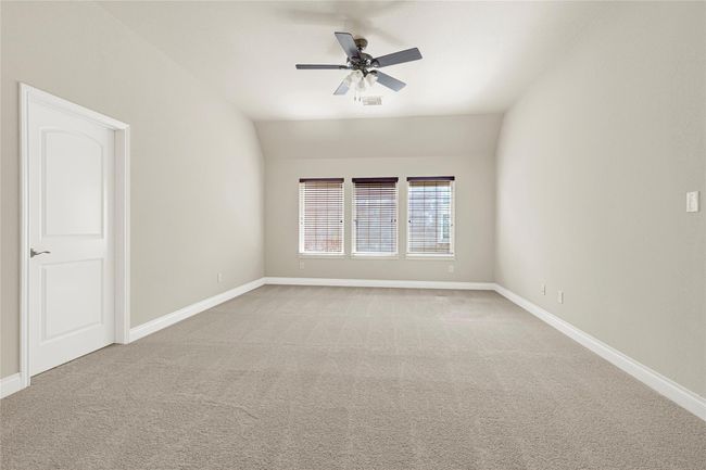The game room offers room to stretch out, play, and unwind. Carpeted for comfort and brightened by tall windows, this space adapts to whatever you need it to be. | Image 31