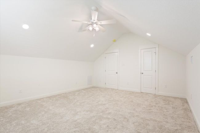 Additional living space featuring vaulted ceiling, carpet floors, recessed lighting, and ceiling fan | Image 32