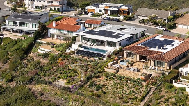 Energy-efficient and advanced smart features include owned Enphase 40-panel solar system, Savant home automation system, integrated security and alarm, tankless water heating, whole-house water filtration, Unico heat pump system, and Lutron and Somfy automated shades. | Image 29