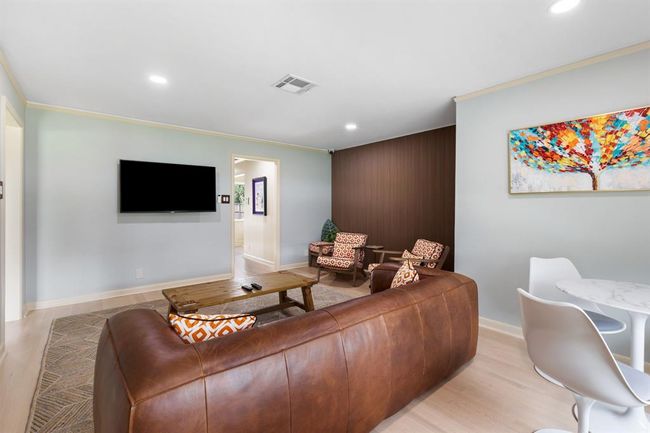 Another view of the light and bright living room | Image 4