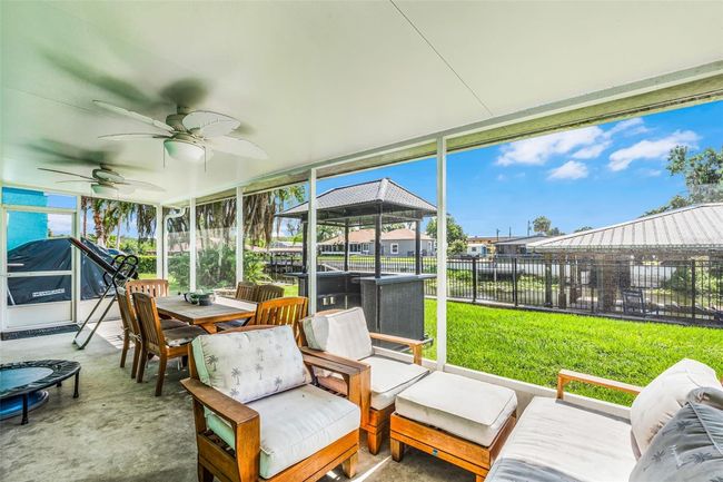 Screened patio with view of water | Image 31