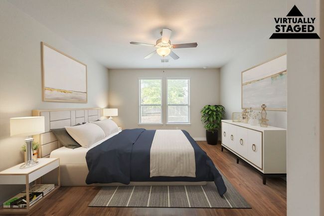 Bedroom featuring dark wood-type flooring, ceiling fan, and baseboards | Image 11