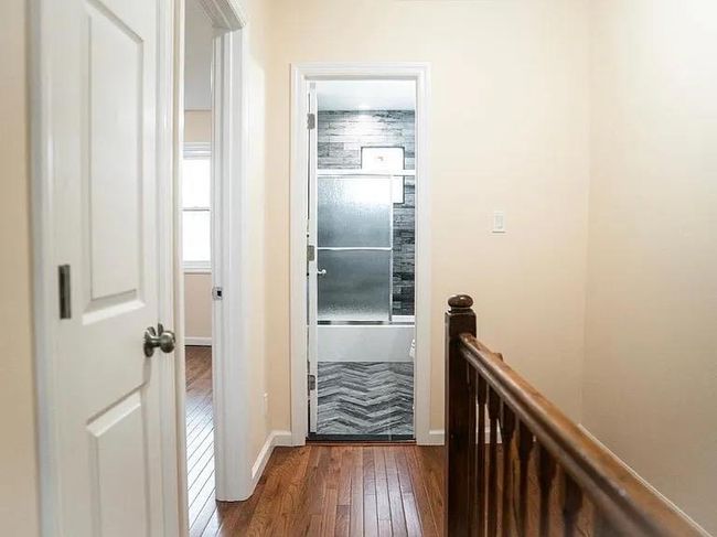 Doorway with baseboards and dark wood-style flooring | Image 6
