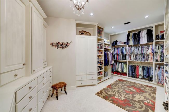 One of two oversized closets with built in drawers and shelves, specific cedar cabinets, and floor to ceiling shoe rack. | Image 24