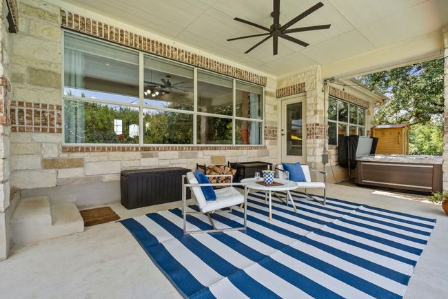 Expansive back patio with oversized outdoor ceiling fan | Image 26