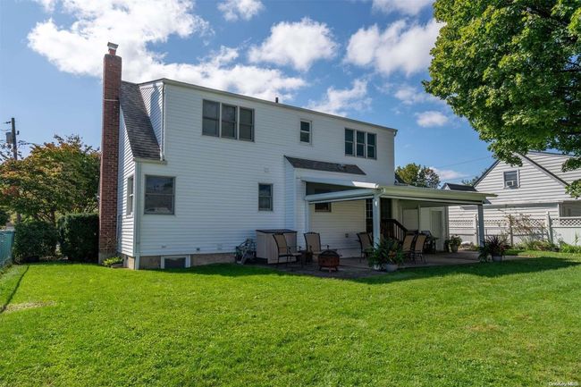 Back yard looking at house with Life Room screens UP | Image 25
