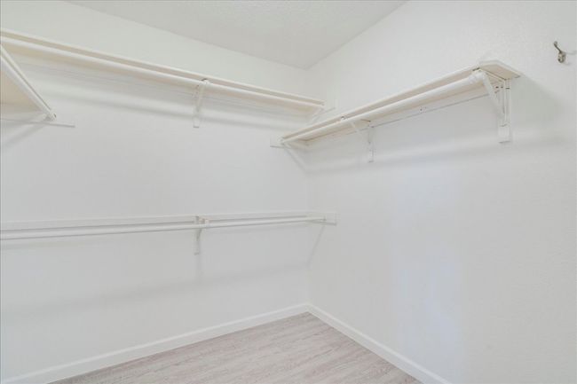 Spacious closet featuring light wood finished floors | Image 20