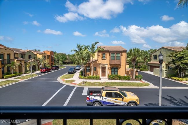 View of street featuring street lighting, sidewalks, curbs, and a residential view | Image 29