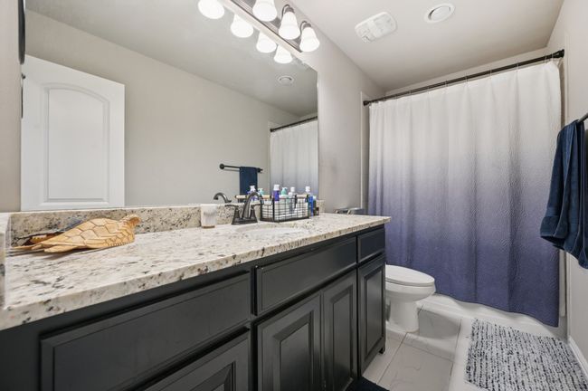 Full bathroom with vanity, marble look tile flooring | Image 17