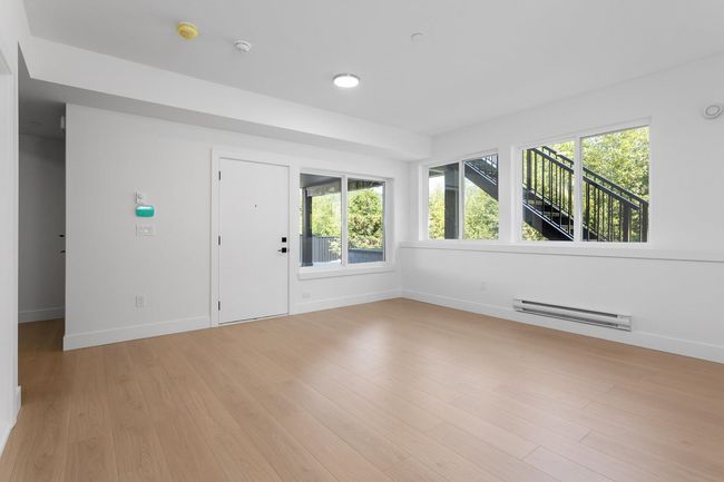 Unfurnished room with baseboards, light wood-style floors, and a baseboard radiator | Image 20