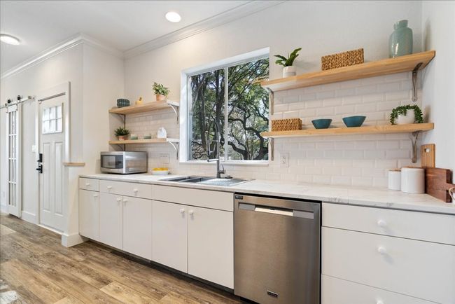 Open shelving and plenty of cabinet space | Image 13