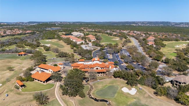 Aerial view of property and surrounding area featuring a golf course and nearby suburban area | Image 22