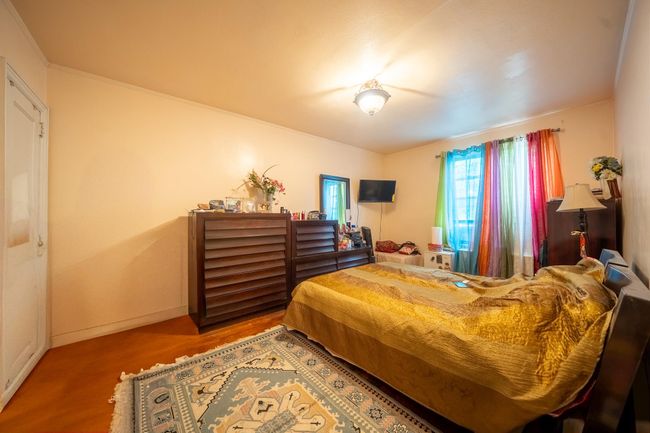 Bedroom featuring wood finished floors and baseboards | Image 18